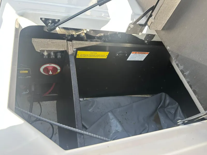 Slide: The Image of Open storage compartment in 2022 Regal LS4 Surf boat. - 18