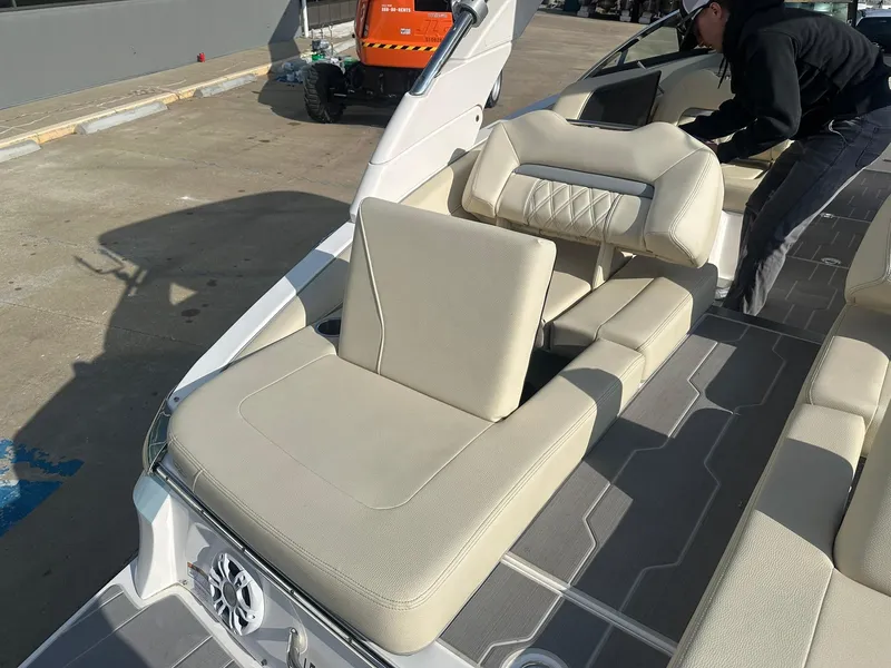 Slide: The Image of 2022 Regal LS4 Surf boat interior with beige seating and modern design. - 30