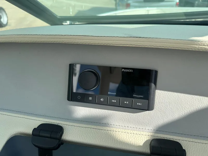 Slide: The Image of 2022 Regal LS4 Surf boat dashboard with Fusion audio system. - 45