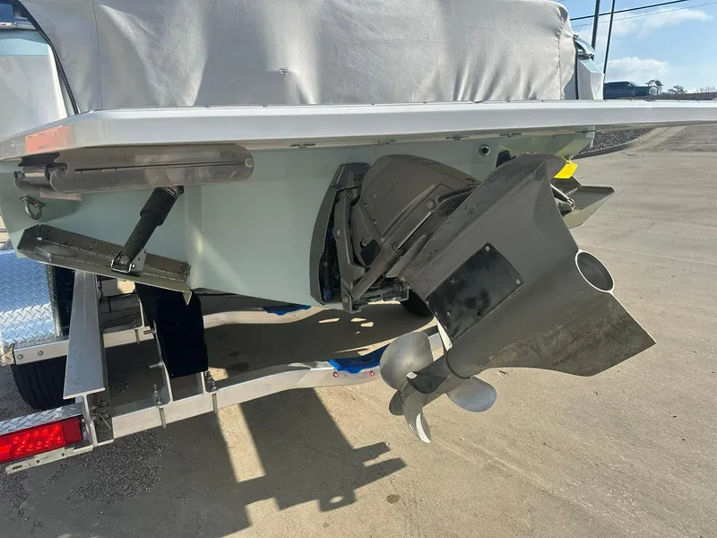 Slide: The Image of 2022 Regal LS4 Surf boat's stern with propeller and trailer. - 8