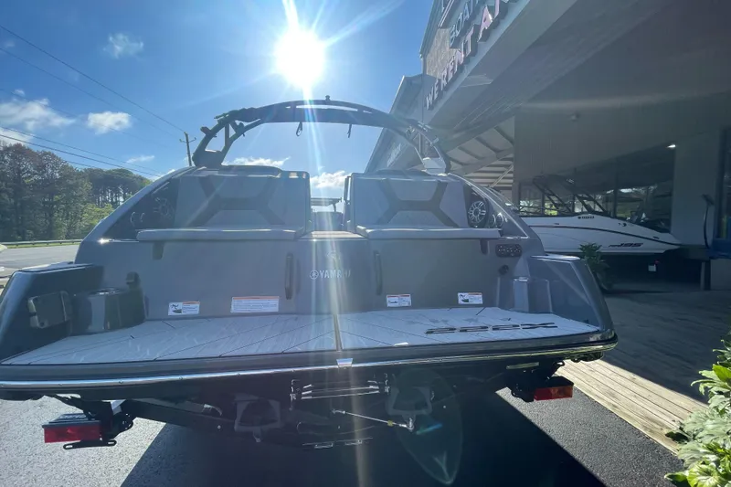 Slide: The Image of 2025 Yamaha Boats 222XD displayed outdoors under bright sunlight. - 12
