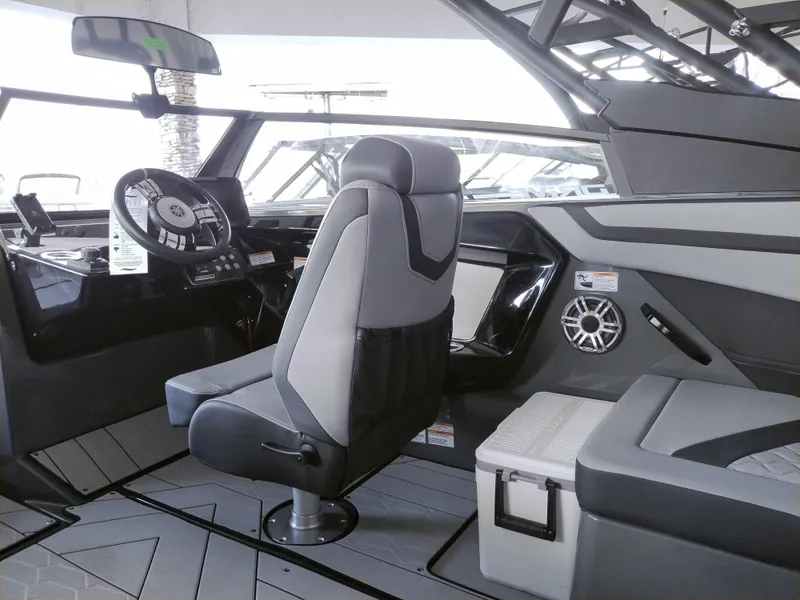 Slide: The Image of 2025 Yamaha Boats 222XD interior with modern helm, seating, and sleek design. - 5
