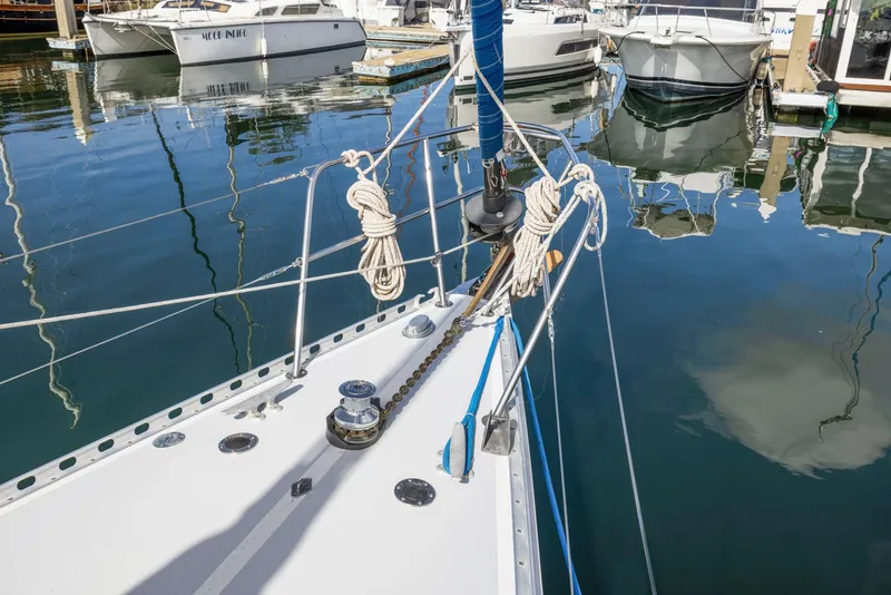 Slide: The Image of 1986 J Boats J/40 sailboat bow with ropes and winch in marina. - 14