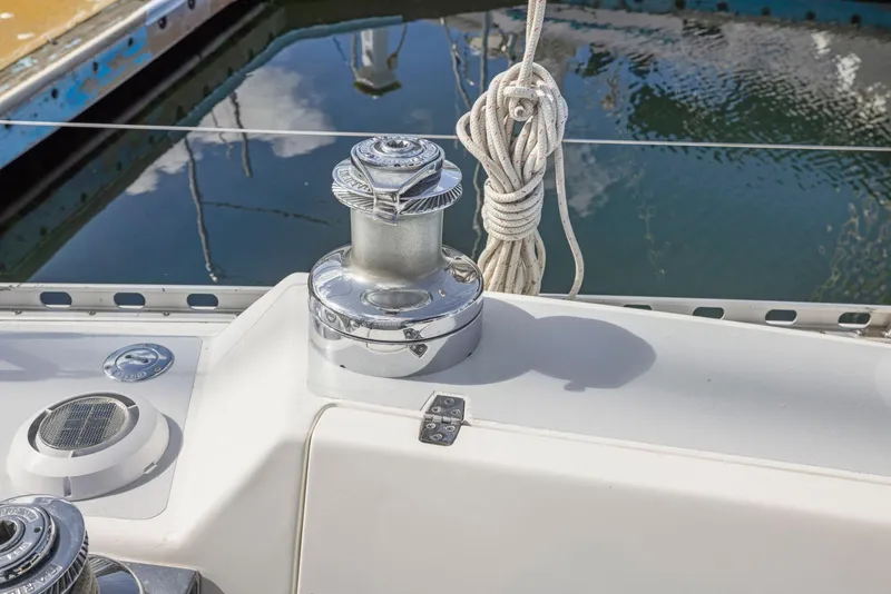 Slide: The Image of Winch and rope on 1986 J Boats J/40 sailboat deck by the water. - 28