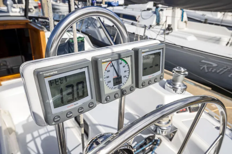 Slide: The Image of 1986 J Boats J/40 yacht cockpit with navigation instruments and steering wheel. - 31