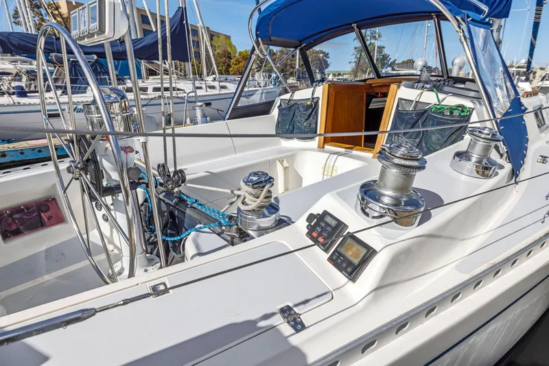 Slide: The Image of 1986 J Boats J/40 sailboat cockpit with steering wheel, winches, and navigation equipment. - 4