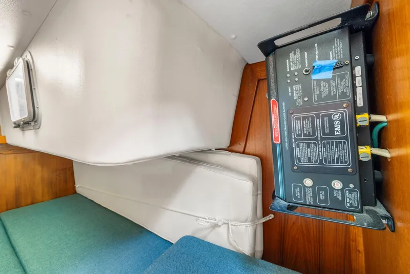 Slide: The Image of Interior of 1986 J Boats J/40 showing electrical panel and seating area. - 45