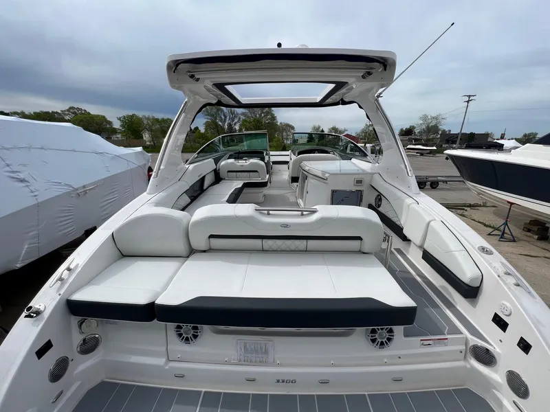 Slide: The Image of 2025 Regal 3300 boat with spacious seating and modern design. - 10