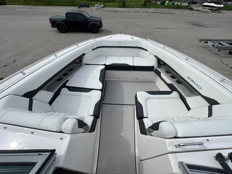 Slide: The Image of 2025 Regal 3300 boat with spacious white seating and sleek design. - 14