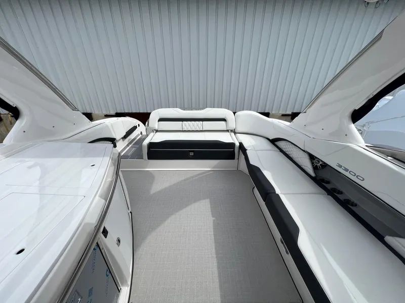Slide: The Image of 2025 Regal 3300 boat interior with sleek white and black seating, modern design. - 17