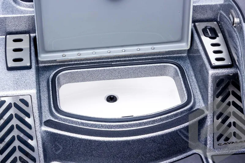 Slide: The Image of 2025 Caymas CX 20 PRO boat storage compartment with open lid, showcasing interior design. - 43