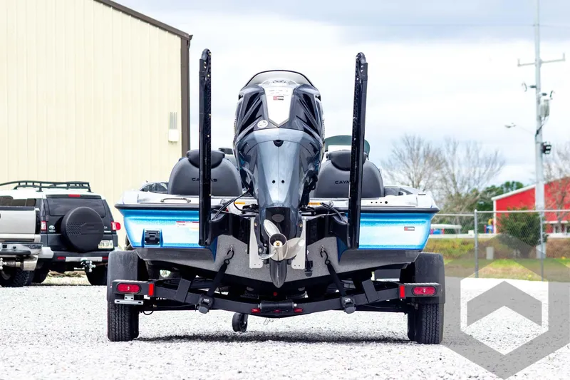 Slide: The Image of 2025 Caymas CX 20 PRO boat on trailer, rear view, outdoors. - 6