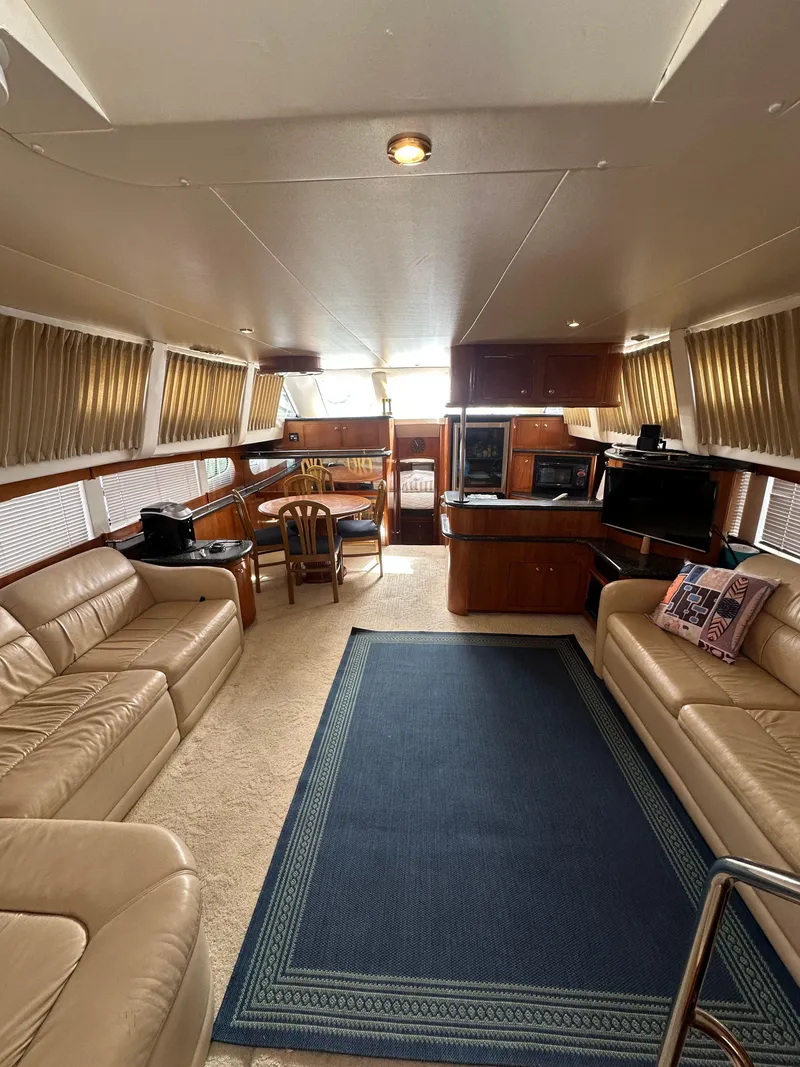 Slide: The Image of Luxurious interior of a 2000 Carver 506 Motor Yacht with leather seating and elegant decor. - 17