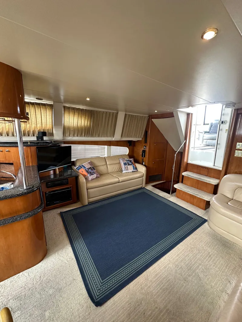 Slide: The Image of Interior of 2000 Carver 506 Motor Yacht with cozy seating and modern amenities. - 19