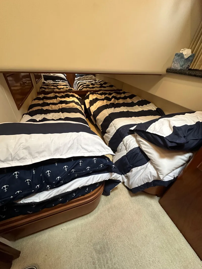 Slide: The Image of Twin beds in 2000 Carver 506 Motor Yacht cabin with nautical-themed bedding. - 37