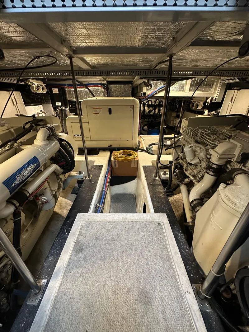 Slide: The Image of Engine room of 2000 Carver 506 Motor Yacht with visible machinery and equipment. - 40