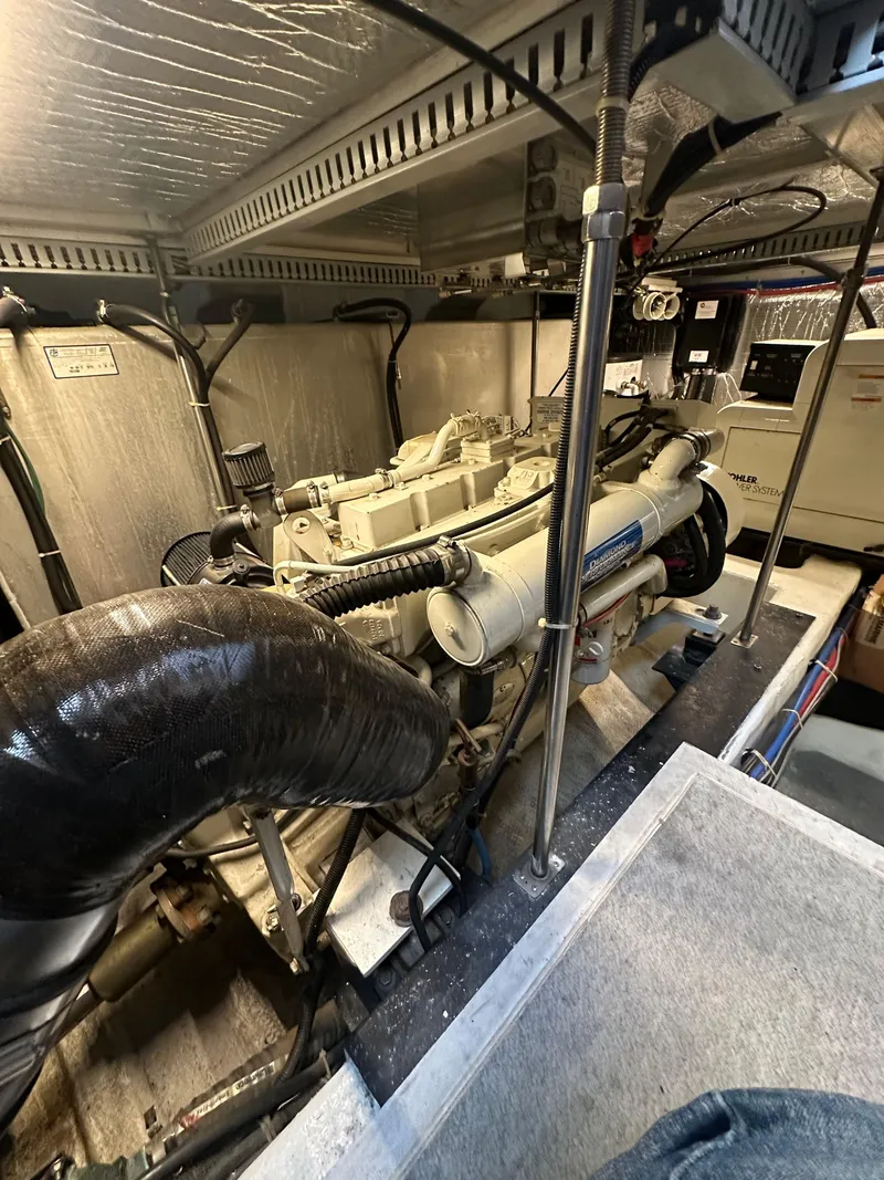 Slide: The Image of Engine room of a 2000 Carver 506 Motor Yacht, showcasing mechanical components and systems. - 41