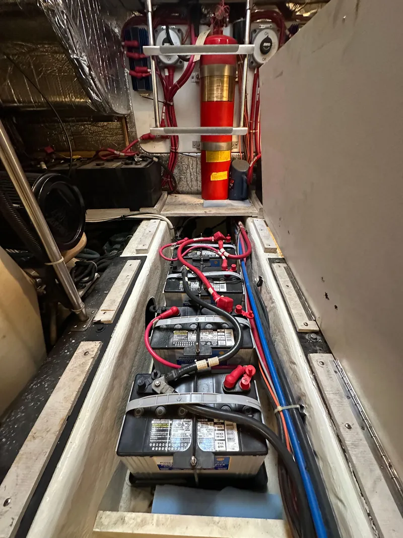 Slide: The Image of Engine room of 2000 Carver 506 Motor Yacht with batteries and wiring. - 47