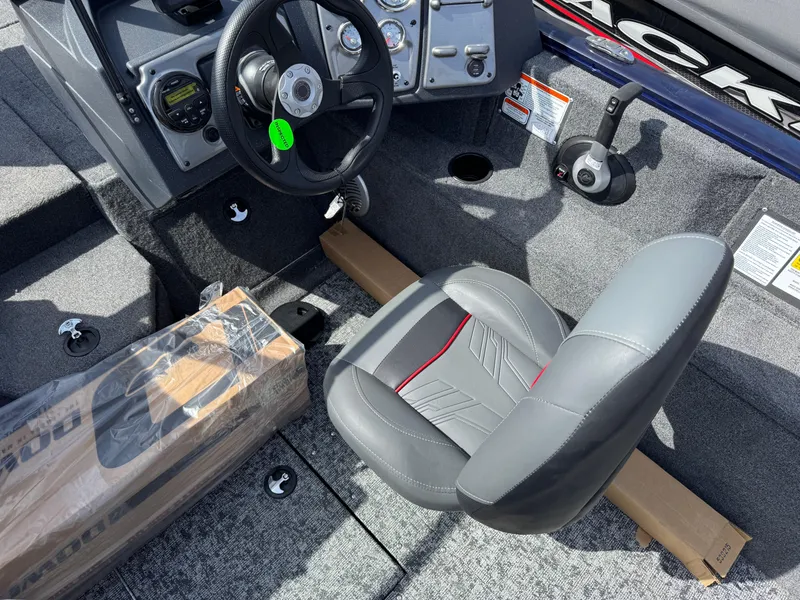 Slide: The Image of 2025 Tracker Pro Guide V-175 Combo boat interior with steering wheel and seat. - 14