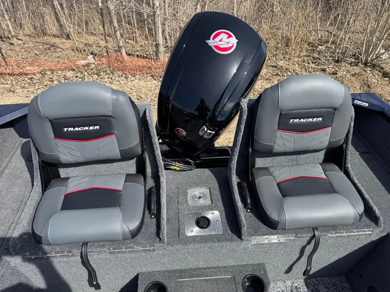 Slide: The Image of 2025 Tracker Pro Guide V-175 Combo boat seats and motor, outdoor setting. - 17