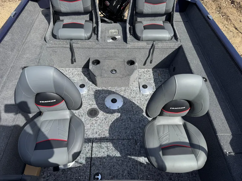 Slide: The Image of 2025 Tracker Pro Guide V-175 Combo boat interior with four gray seats and carpeted flooring. - 4