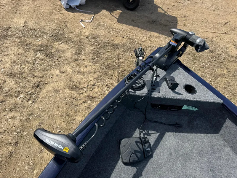 Slide: The Image of 2025 Tracker Pro Guide V-175 Combo boat with Minn Kota trolling motor on deck. - 6