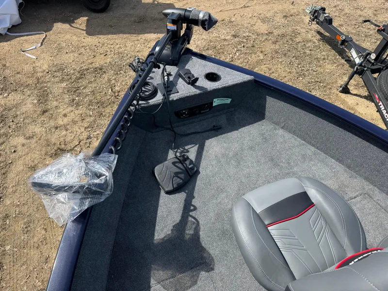 Slide: The Image of 2025 Tracker Pro Guide V-175 Combo boat interior with seating and control panel. - 7