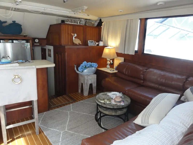 Slide: The Image of Luxurious interior of a 1990 Viking 45 Convertible yacht with leather seating and nautical decor. - 13