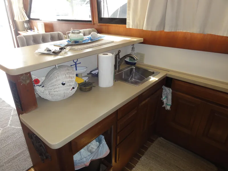 Slide: The Image of Interior of 1990 Viking 45 Convertible yacht kitchen with sink and countertop. - 19