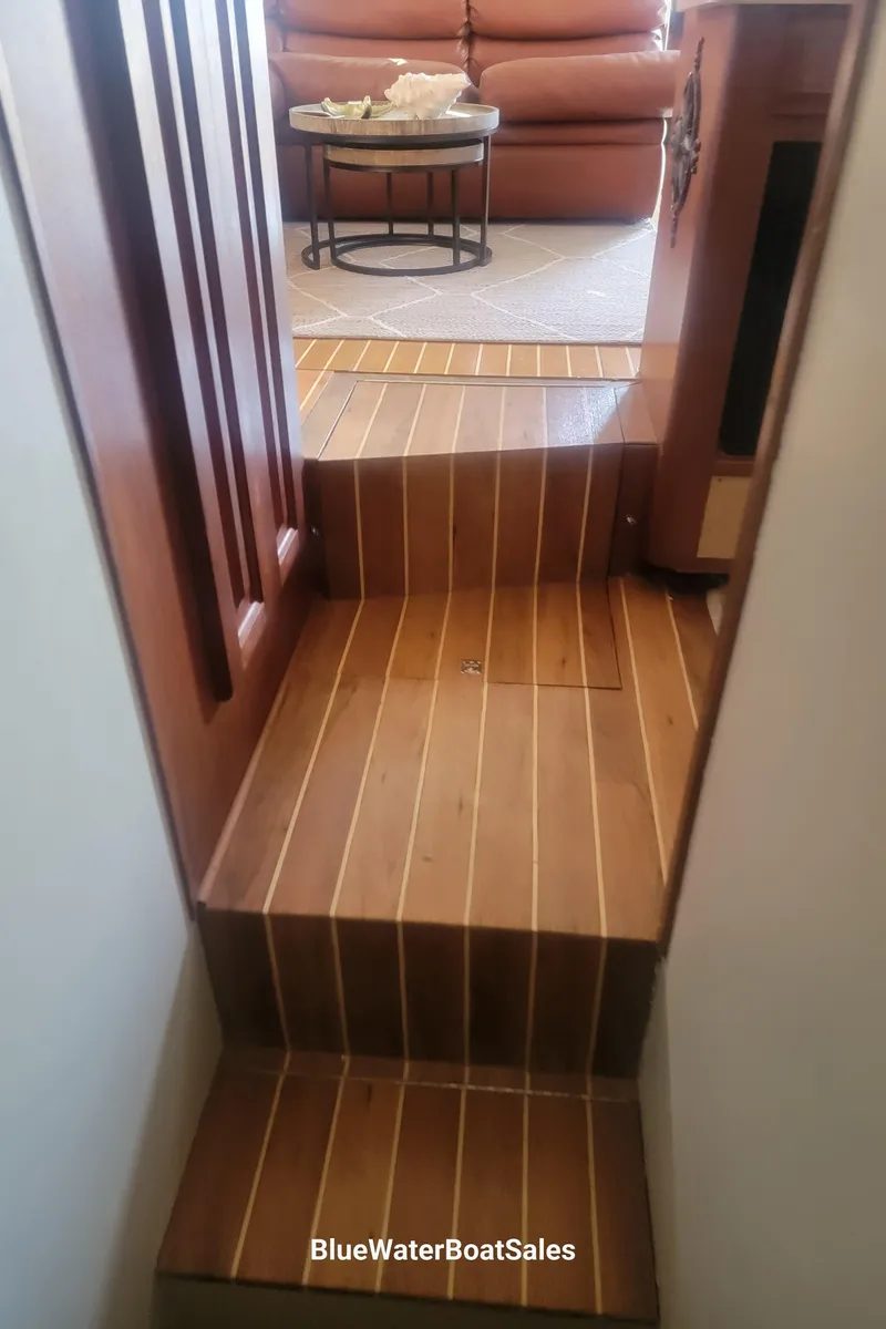 Slide: The Image of Staircase inside 1990 Viking 45 Convertible yacht with wooden flooring. - 25