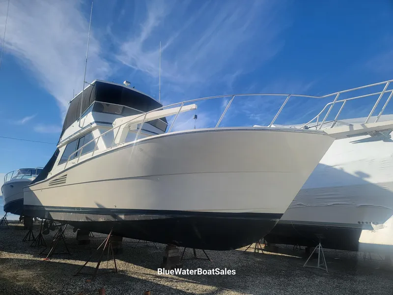 Slide: The Image of 1990 Viking 45 Convertible boat on display at BlueWaterBoatSales. - 3