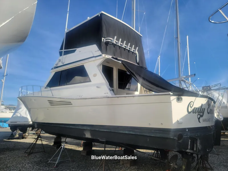 Slide: The Image of 1990 Viking 45 Convertible boat on stands, displayed at BlueWaterBoatSales. - 5