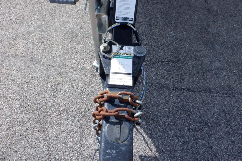 Slide: The Image of Trailer hitch of a 2012 Sea Ray 205 Sport with safety chains attached. - 11
