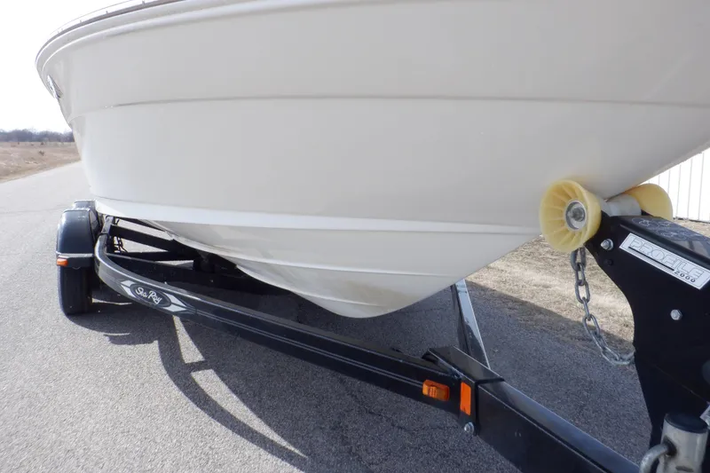 Slide: The Image of 2012 Sea Ray 205 Sport boat on trailer, side view, outdoors. - 12