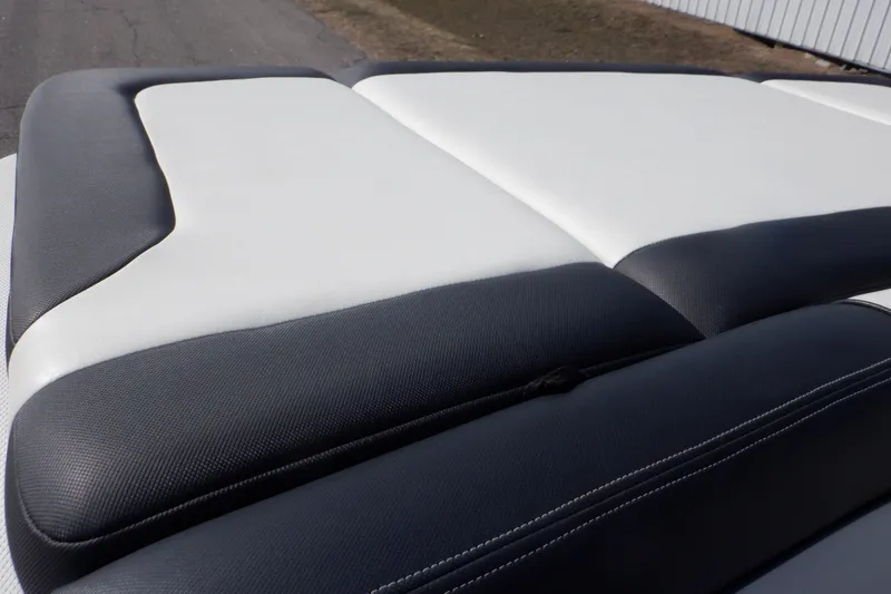 Slide: The Image of 2012 Sea Ray 205 Sport boat seat with black and white upholstery. - 18