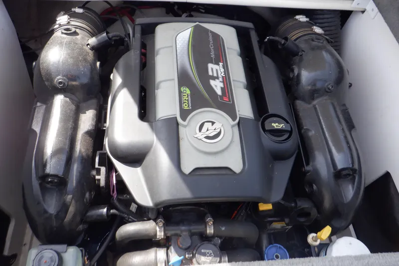 Slide: The Image of Engine of a 2012 Sea Ray 205 Sport boat, featuring a 4.3-liter MerCruiser. - 20