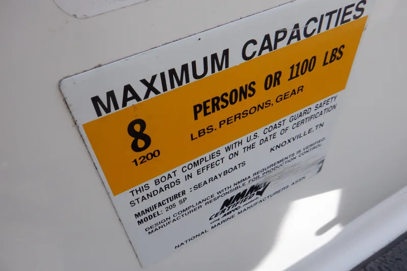 Slide: The Image of Sea Ray 205 Sport 2012 capacity label, maximum 8 persons or 1100 lbs. - 24