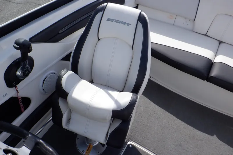 Slide: The Image of 2012 Sea Ray 205 Sport boat interior with white and black seating. - 26