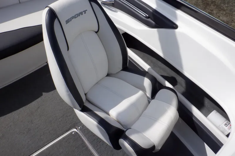 Slide: The Image of White and black seat in 2012 Sea Ray 205 Sport boat interior. - 27