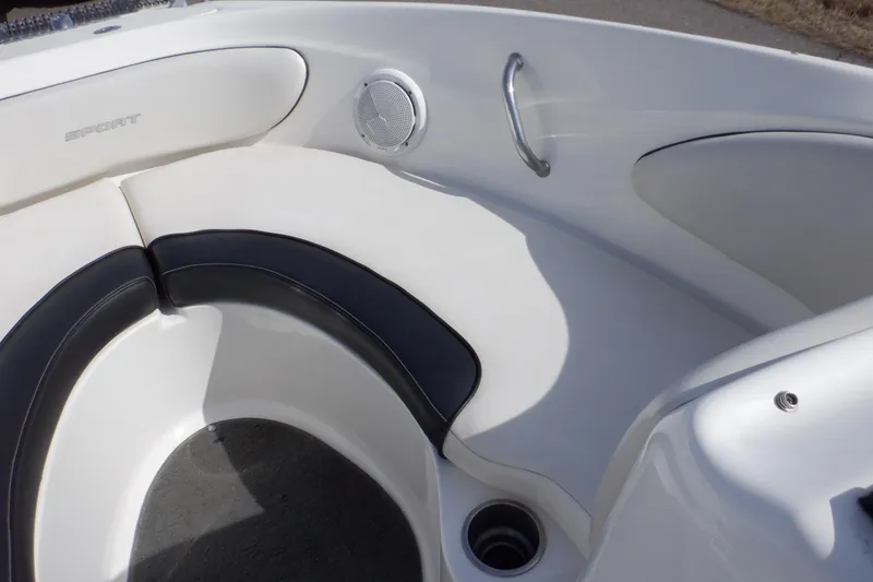 Slide: The Image of 2012 Sea Ray 205 Sport boat interior with white and black seating. - 30