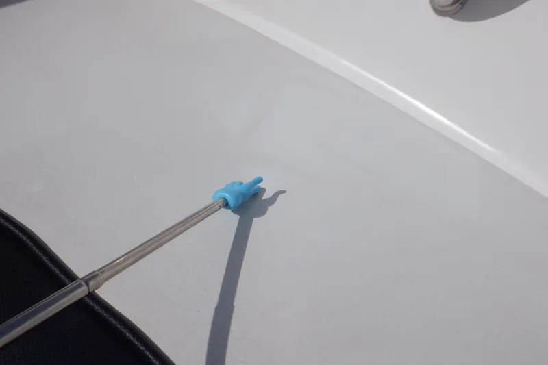 Slide: The Image of Cleaning tool on 2012 Sea Ray 205 Sport boat surface. - 32
