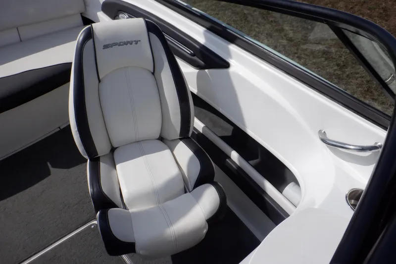 Slide: The Image of 2012 Sea Ray 205 Sport boat interior with white and black seating. - 38