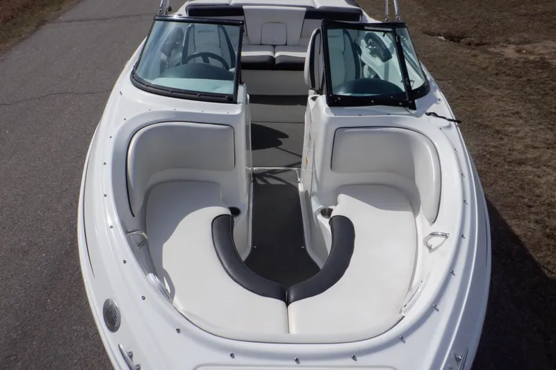 Slide: The Image of 2012 Sea Ray 205 Sport boat with white seating and open bow design. - 4