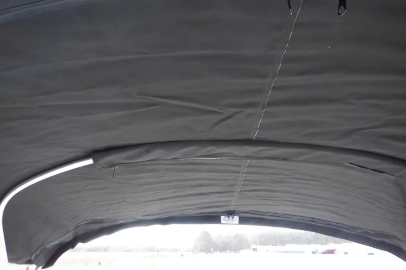 Slide: The Image of 2012 Sea Ray 205 Sport boat canopy, black fabric with metal frame. - 40