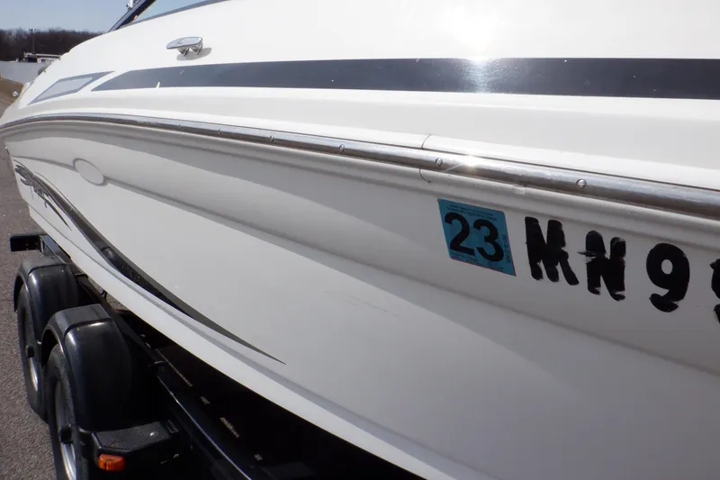 Slide: The Image of 2012 Sea Ray 205 Sport boat on trailer, side view with registration number. - 44