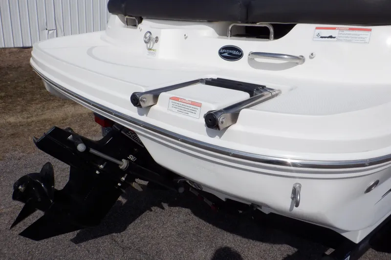 Slide: The Image of Rear view of a 2012 Sea Ray 205 Sport boat with swim platform and ladder. - 50