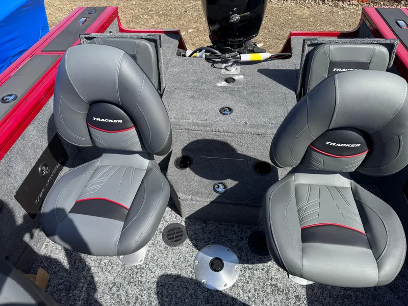 Slide: The Image of 2025 Tracker Targa V-18 Combo boat interior with two gray seats. - 10