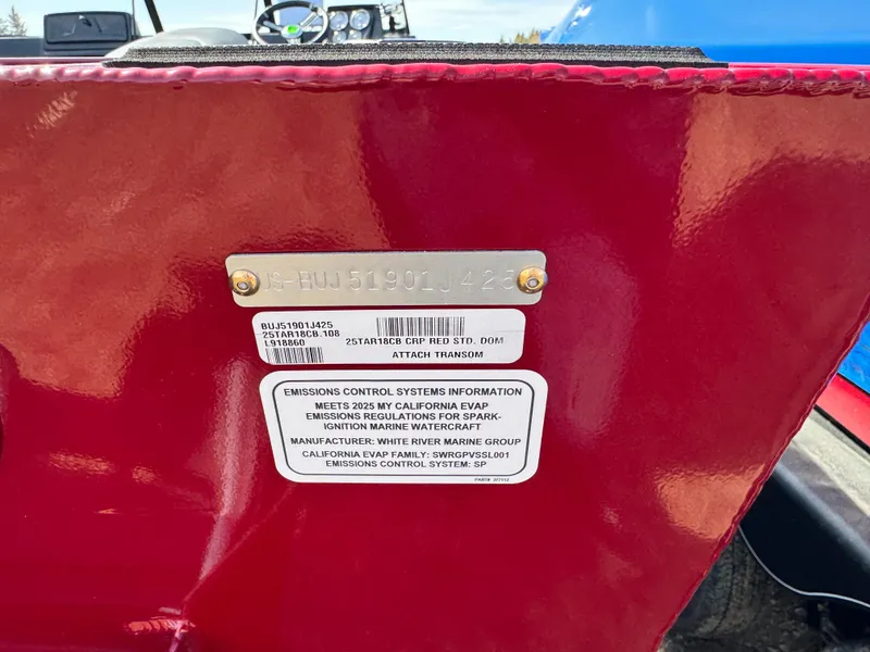 Slide: The Image of 2025 Tracker Targa V-18 Combo boat, red exterior, emissions control information displayed. - 19