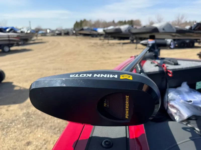 Slide: The Image of 2025 Tracker Targa V-18 Combo with Minn Kota PowerDrive motor in a boatyard. - 4