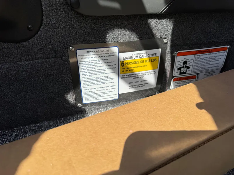 Slide: The Image of 2025 Tracker Targa V-18 Combo capacity label, showing maximum of 6 persons or 881 lbs. - 7
